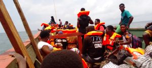 Passengers crossing the Volta Lake with a boat